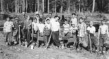 Tree planting crew (Boy Scouts?) with spades and seedling buckets