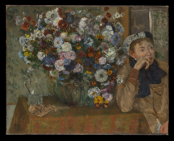 Edgar Degas painting of a seated woman beside a vase overflowing with flowers in a richly colored room.