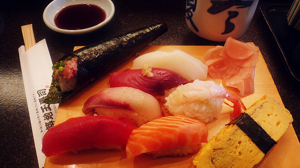 Nigirizushi and temaki, different types of Japanese sushi, served and ready to be eaten.