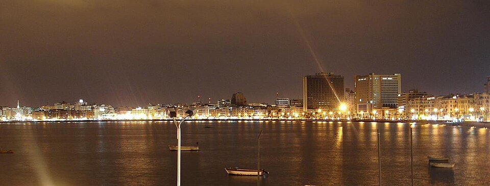 Alexandria harbour, looking south from the Mediterranean Sea, along the curved coastline.