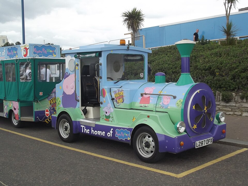 A train with a picture of very popular pigs, Peppa Pig and her family.