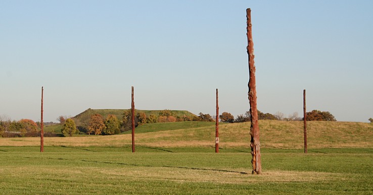 The view of Monk's Mound while standing in the reconstructed Woodhenge.