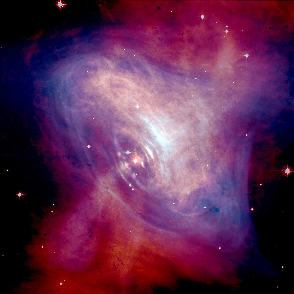 Composite Optical/X-ray image of the Crab Nebula. It shows the energy coming from the surrounding nebula, which is caused by the magnetic fields and particles from the central pulsar.