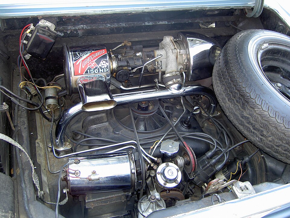 The Chevrolet Corvair's turbocharged engine. The turbo, located at top right, feeds pressurized air into the engine through the chrome T-pipe spanning the engine.