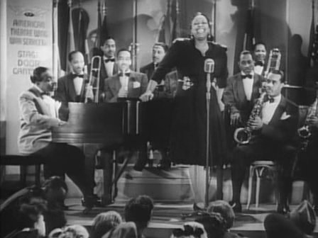 Count Basie with his orchestra and vocalist Ethel Waters, in the movie Stage Door Canteen, 1943