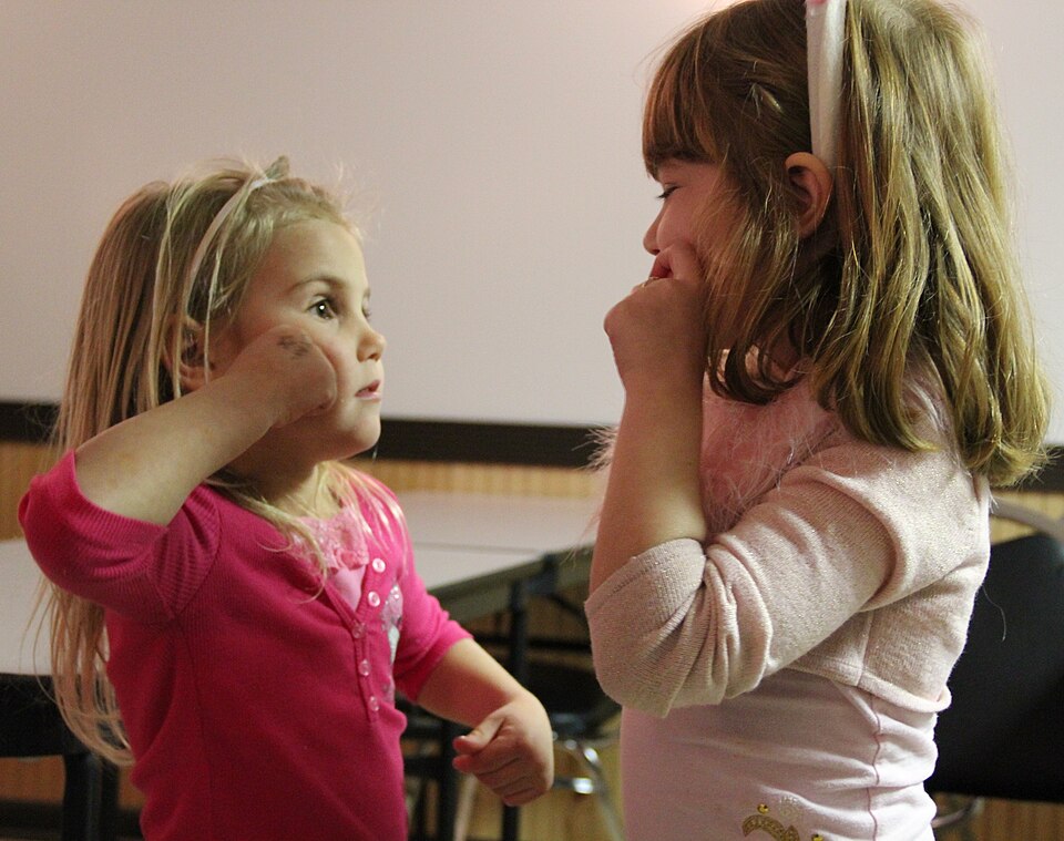 Girls using sign language