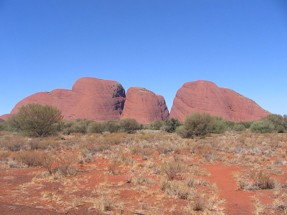 Kata Tjuta in Central Australia. Dreamtime stories say the largest monolith is the home of Wanambi the snake. His breath can be heard in the valleys.