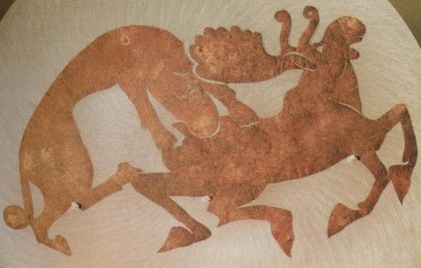 Iron Age saddle from Siberia, depicting a moose being hunted by a Siberian tiger.
