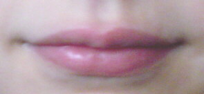 A closed human female mouth