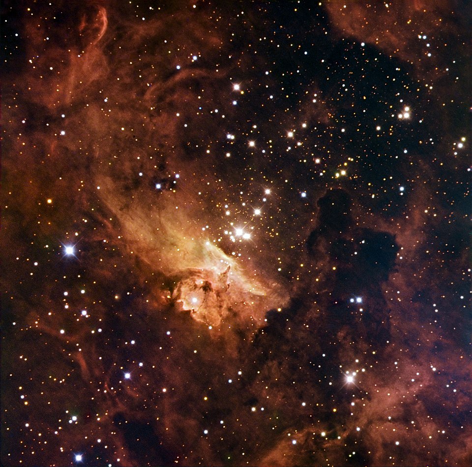 The open star cluster Pismis 24 is in the nebula NGC 6357. It has some of the largest stars known. Pismis 24-1 has nearly 300 times the mass of the Sun. It is a multiple system of at least three stars. The strange shapes taken by the clouds are a result of the vast radiation emitted by these huge, hot stars. This image combines image data with three different filters in visible light from the 1.5-metre Danish telescope at the ESO La Silla Observatory in Chile.