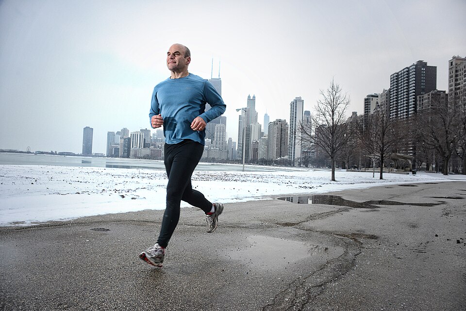 A man running in a park in Chicago.