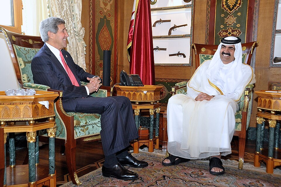 Former Emir Hamad bin Khalifa Al Thani and US Secretary of State John Kerry in 2013.