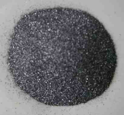 Small grains of silicon because it has been crushed. This is not the silicon used in computers.