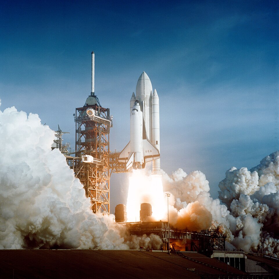 The US Space Shuttle flew 135 times from 1981 to 2011, supporting Spacelab, Mir, the Hubble Space Telescope, and the ISS. (Columbia{{'s}} maiden launch, which had a white external tank, shown)