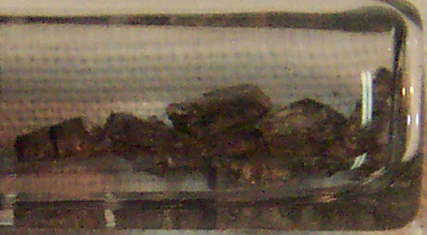 Granules of strontium in a glass tube