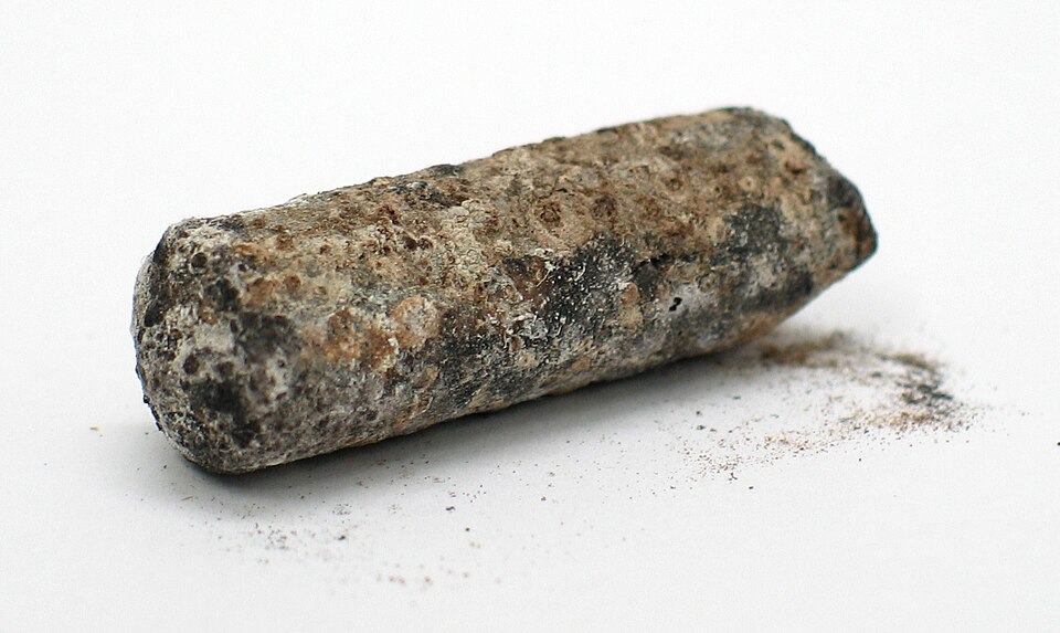 A corroded thallium rod