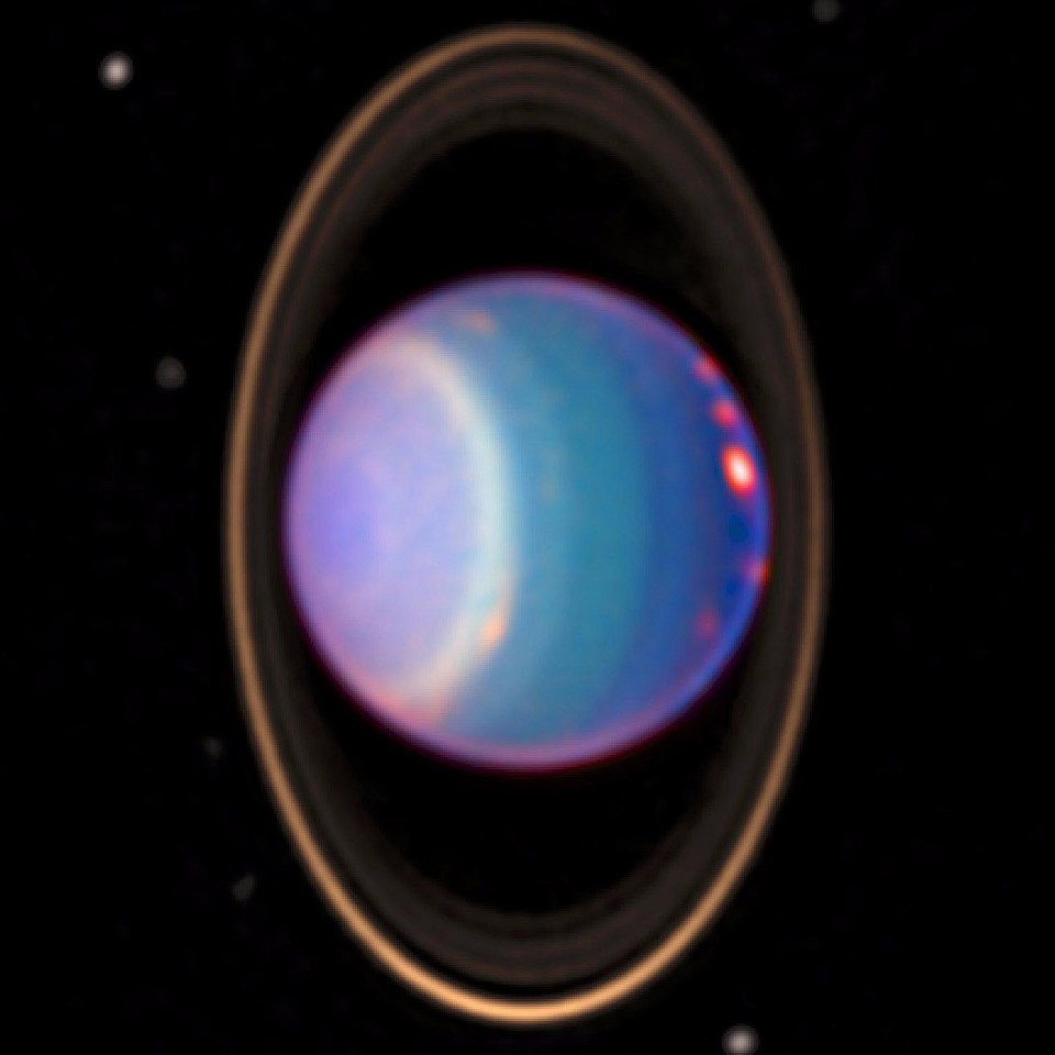 A 1998 false-colour near-infrared image of Uranus showing cloud bands, rings, and moons obtained by the Hubble Space Telescope's NICMOS camera